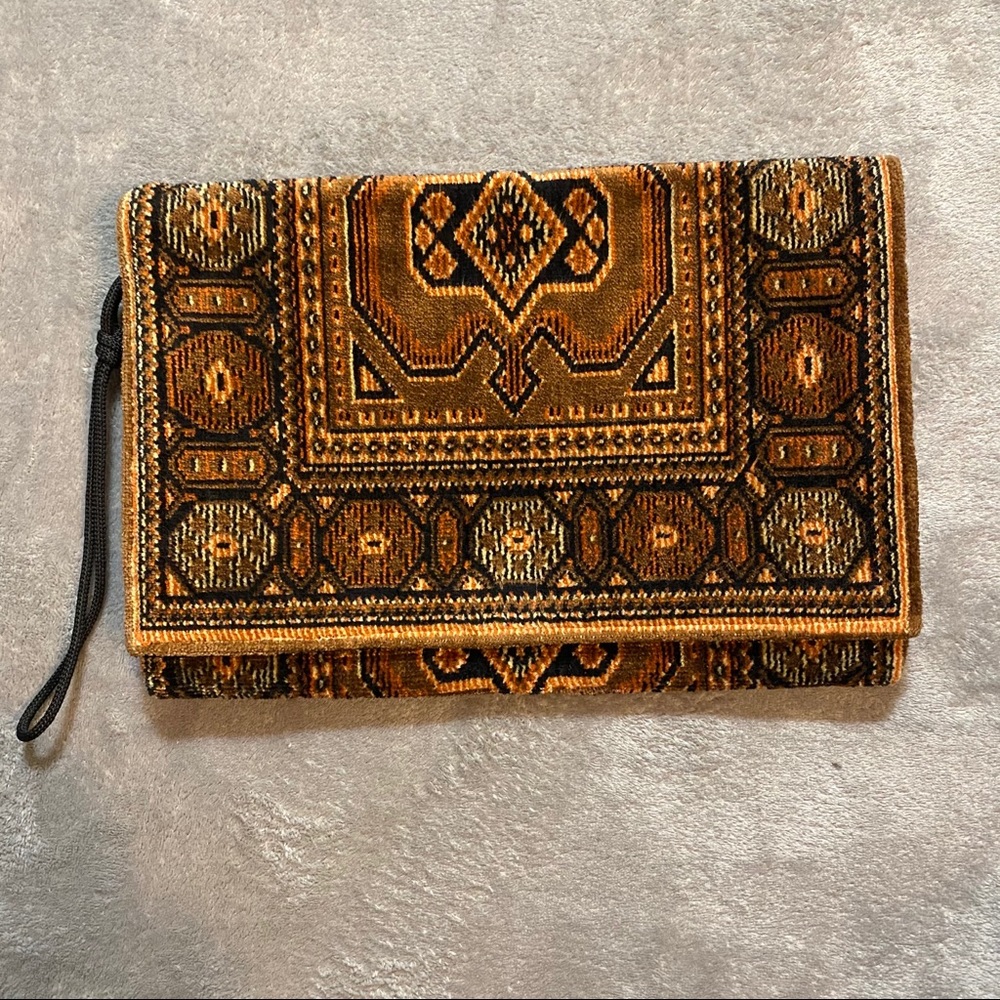 Elegant Brown and Black Leather Wristlet with Ornate Designs